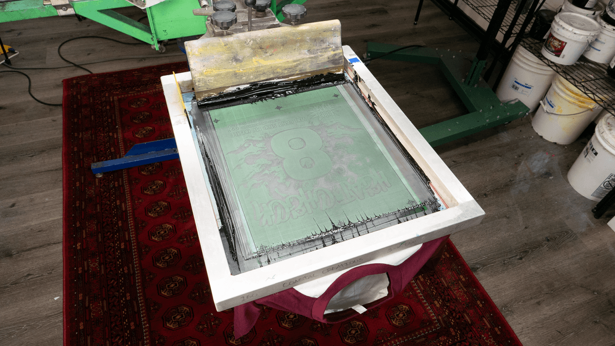 Screen printing equipment laid out for a print run