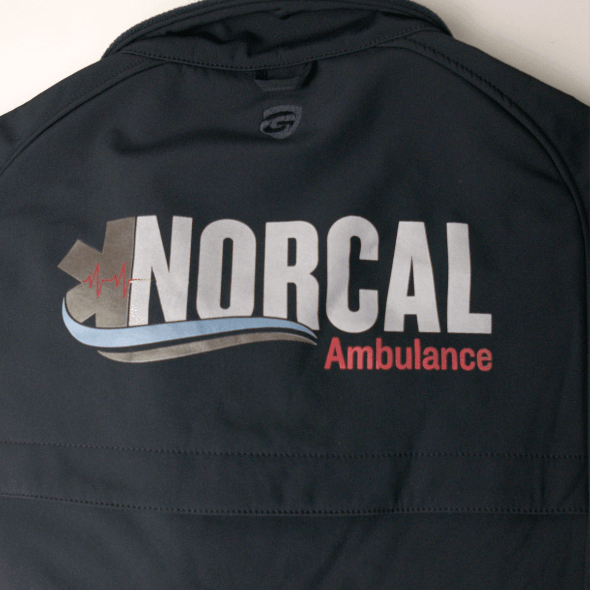 Screen printed and embroidered apparel side by side