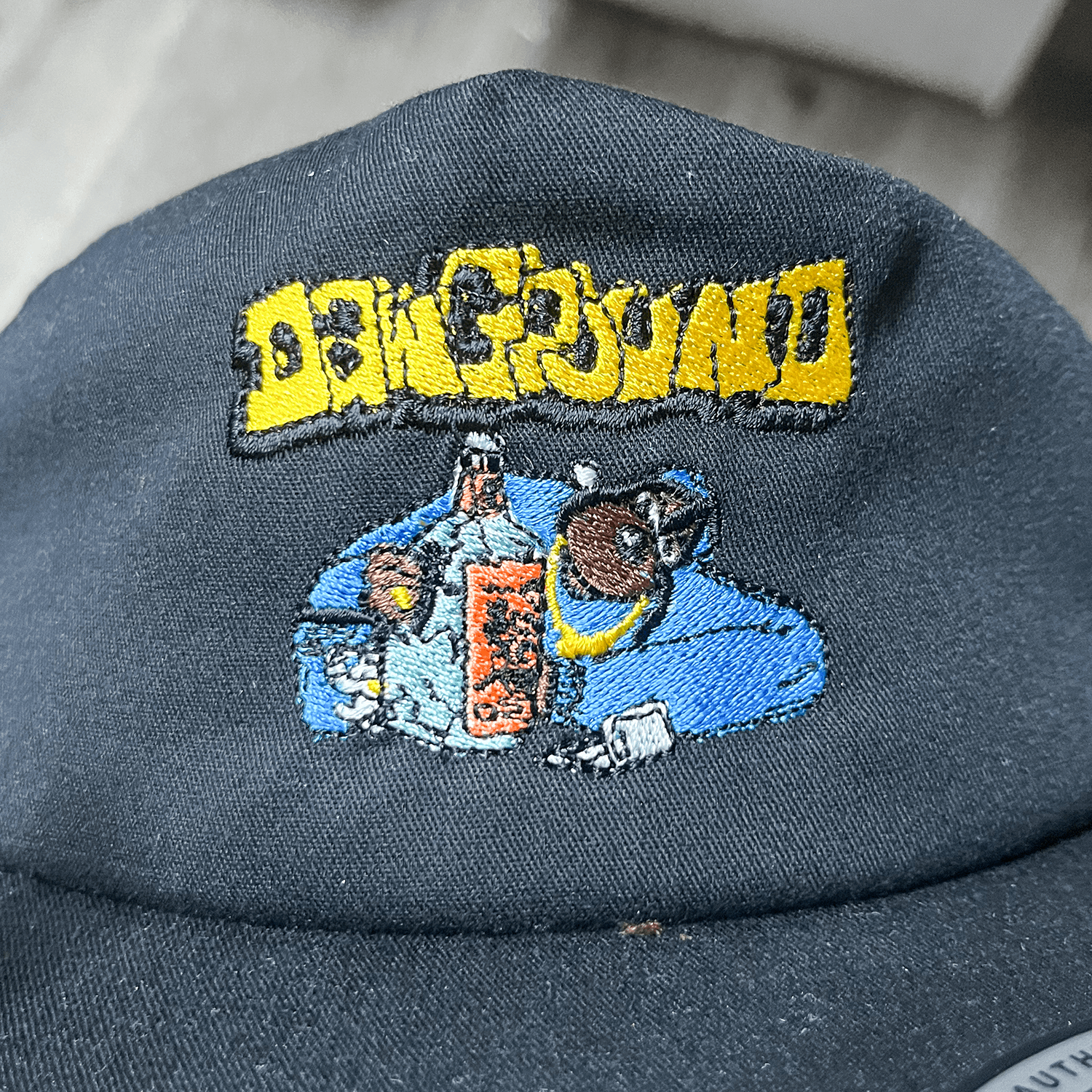 DPFC Snoop embroidery on dark fabric