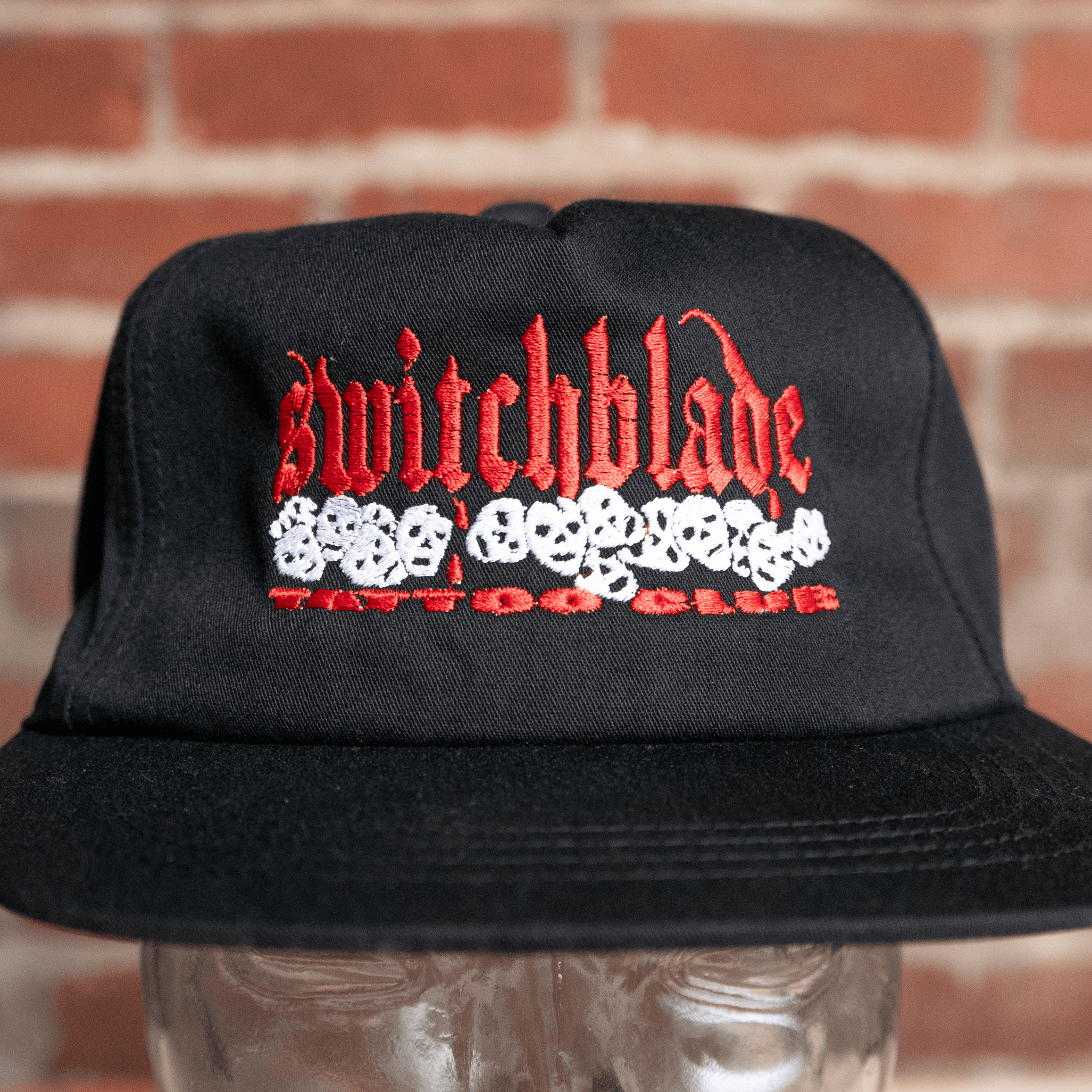 Switchblade embroidered hat close-up